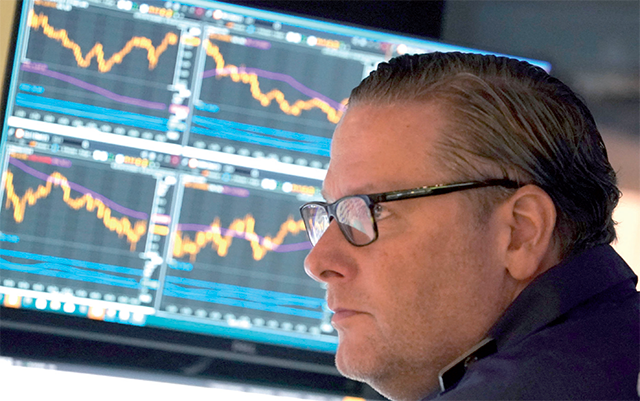 A trader on the floor at the New York Stock Exchange in New York during the opening bell on April 17, 2023 (AFP photo)
