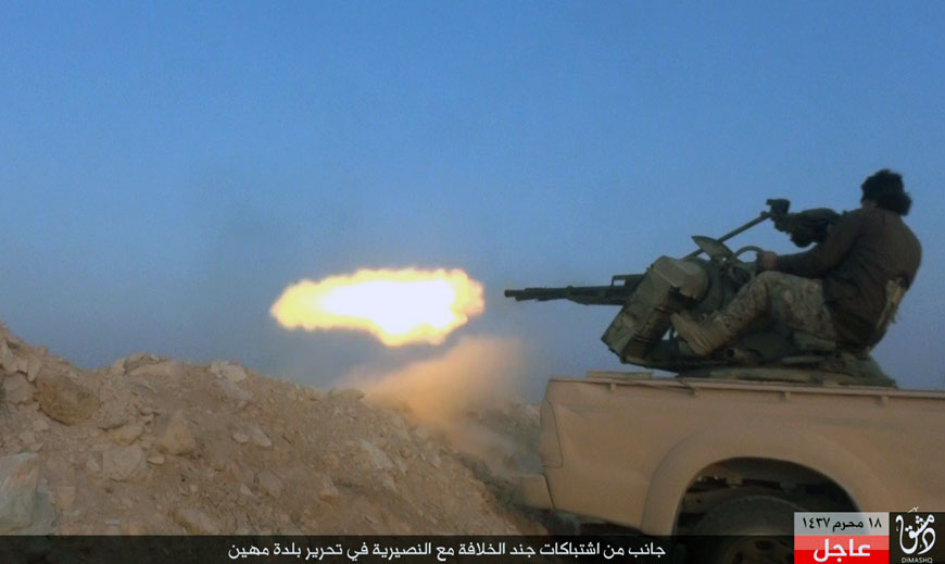 This image posted Sunday by a website used by Daesh shows a militant firing his weapon during a battle against Syrian government troops in the village of Mahin, central Homs province, Syria (AP photo)