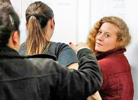 Palestinian girl Ahed Tamimi, 16, is being dragged to Israeli occupation military court on Wednesday (Photo courtesy of Palestinian Information Centre’s Facebook page)