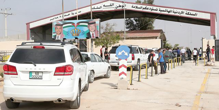 Passenger vehicles wait in line to enter Syria after the Jaber/Nasib crossing between Jordan and Syria (JT file)