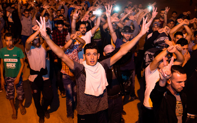 Protesters from Rif movement ‘Hirak’ chant during a demonstration against corruption, repression and unemployment in Imzouren, Morocco, Sunday (AFP photo)