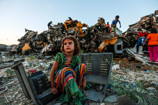 A Palestinian child plays in an impoverished area of the Khan Younis refugee camp, southern Gaza Strip, on Saturday (AFP photo)