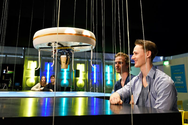 A drone brings drinks to customers in the world’s first drone cafe in Eindhoven (AFP photo)