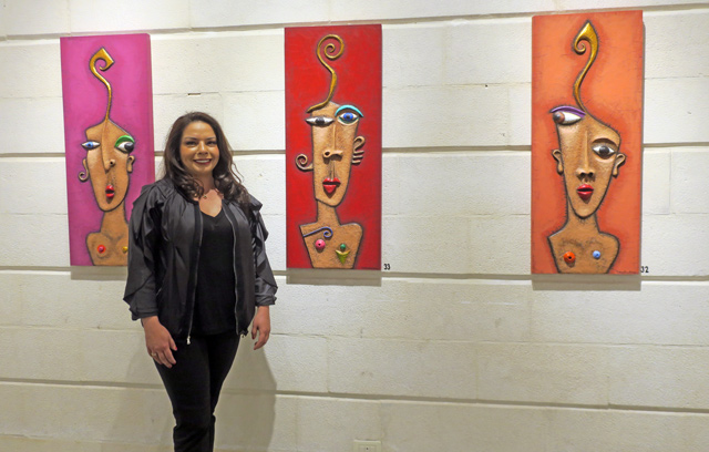 Karima Ben Otman poses in front of her paintings at the opening of her new exhibition at the Wadi Finan art gallery on Saturday (Photo courtesy of Wadi Finan art gallery)