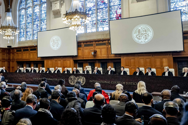 ICJ President Joan Donoghue (centre) speaks at the International Court of Justice (ICJ) prior to the verdict announcement in the genocide case against Israel, brought by South Africa, in The Hague on Friday (AFP photo)