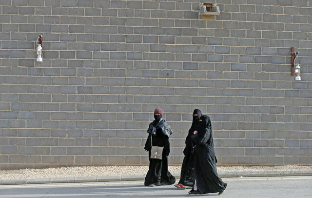 Women walk as they participate in Janadriyah Cultural Festival on the outskirts of Riyadh, Saudi Arabia, on Monday (Reuters photo)