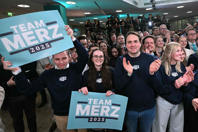 Supporters of the Christian Democratic Union (CDU) react after the first exit polls in the German general elections were announced on TV during the electoral evening in Berlin on February 23, 2025 (AFP photo)