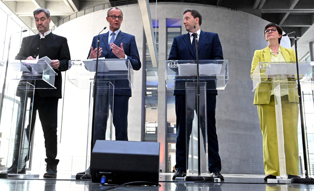 (L-R) The leader of the conservative Christian Social Union (CSU) Markus Soeder, the leader of Germany's Christian Democratic Union (CDU) party Friedrich Merz and the co-leaders of Germany's social democratic SPD party Lars Klingbeil and Saskia Esken give a statement in Berlin on March 8, 2025 AFP photo)