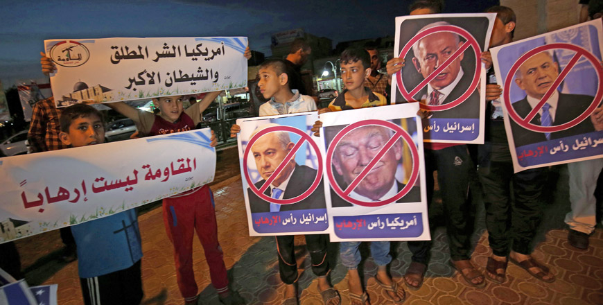 Palestinians protest against the visit by US President Donald Trump to Israel, in Rafah in the southern Gaza Strip, on Monday (AFP photo)