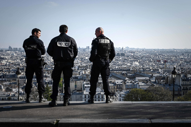 In this file photo taken on March 31, 2020, French police officers patrol in the touristic district of Montmartre in Paris on the 15th day of a strict lockdown in France aimed at curbing the spread of the COVID-19 infection, caused by the novel coronavirus (AFP photo)