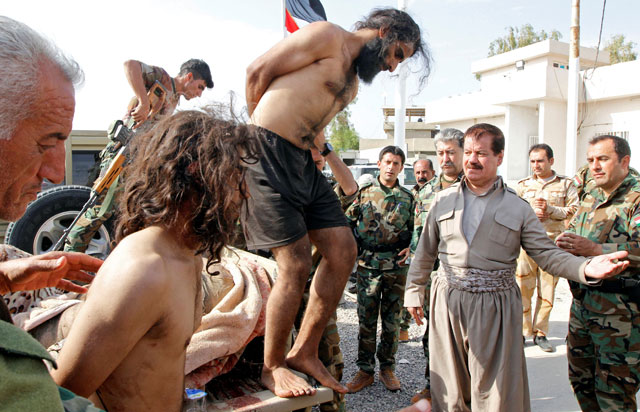 Kurdish peshmerga forces detain men suspected of being Daesh militants southwest of Kirkuk, Iraq, on Monday (Reuters photo)