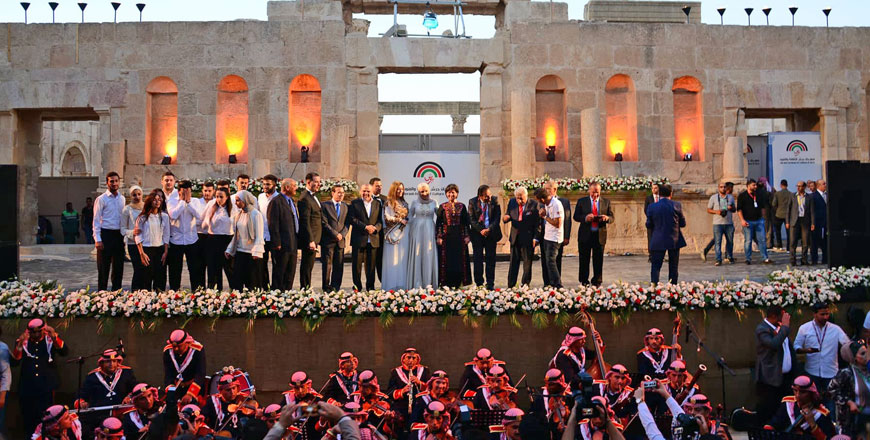 Officials and staff of Jerash festival take to the stage as the 33rd edition of the signature cultural event is inaugurated on Thursday (Photo by Amjad Ghsoun)