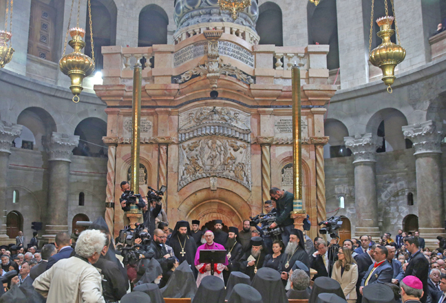 Papal Nuncio Archbishop Giuseppe Lazzarotto (centre), Christian clergymen and other guests take part in a ceremony marking the end of restoration work on the site of Jesus' tomb, in the Church of the Holy Sepulchre, in Jerusalem's Old City on Wednesday (Reuters photo by Menahem Kahana )