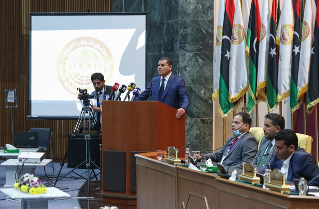 Libya's prime minister-designate Abdul Hamid Dbeibah addresses lawmakers during the first reunited parliamentarian session, in the coastal city of Sirte east of the capital, on Tuesday (AFP photo)
