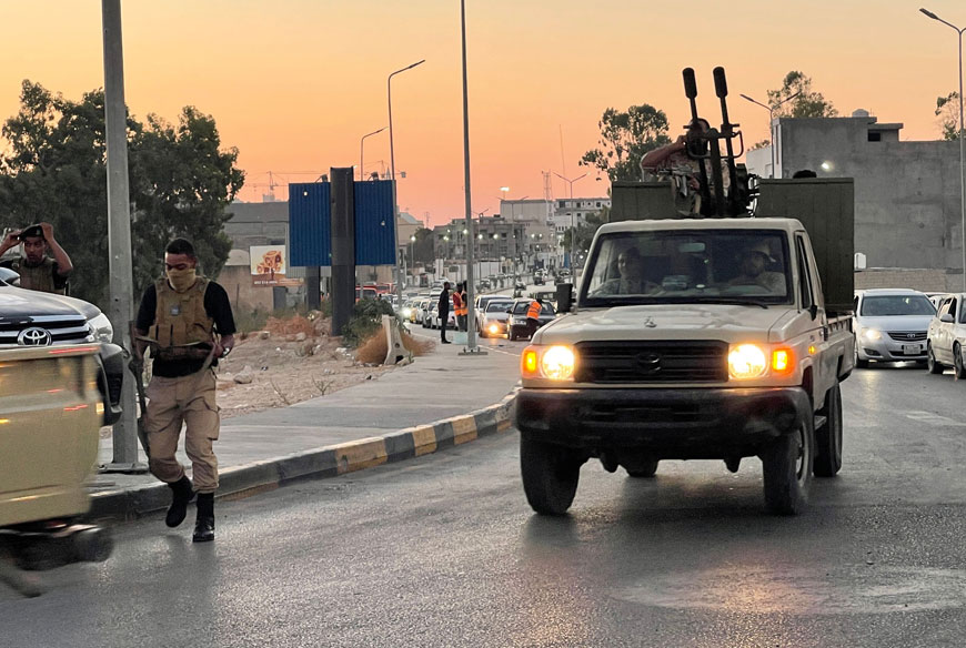Members of the '444 Brigade' affiliated with Libya's ministry of defence man positions in the area of an overnight gunbattle in Tripoli's suburb of Ain Zara, on Friday (AFP photo)