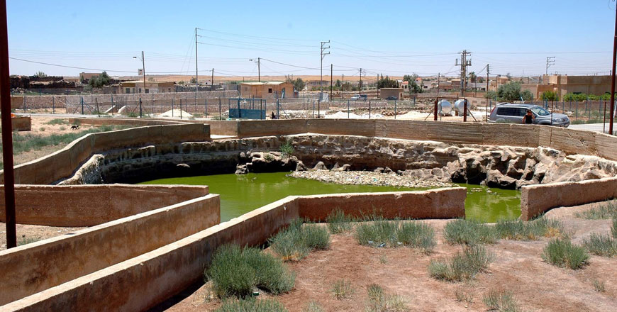 A view from the settling tank onto the first of the three main cisterns with rounded enclosure walls in Al Dafanya (27km northeast of Um Al Jimal) (Photo courtesy of Ulrich Bellwald)