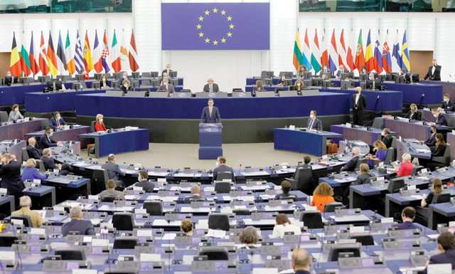 Polish Prime Minister Mateusz Morawiecki (centre) delivers a speech during a debate on the rule of law crisis in Poland and the primacy of EU law at the European Parliament in Strasbourg, on Tuesday (AFP photo)