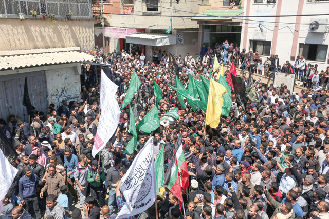 Palestinians carry the body of Marwan Qudeih, who was killed by Israeli occupation forces during the ‘Great March of Return’ near Gaza-Israel border, during his funeral ceremony at Al Taqwa Mosque in the Khoza'a town of Khan Younis, Gaza, on Monday (Anadolu Agency photo)