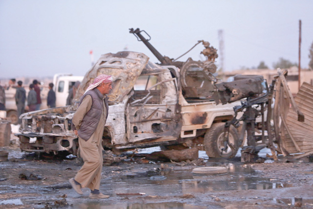 This photo, taken on Tuesday, shows destroyed vehicles following a car bomb attack at a local market in the Turkish-held Syrian Kurdish town of Tall Halaf along the border with Turkey in the northeastern Hassakeh province (AFP photo)