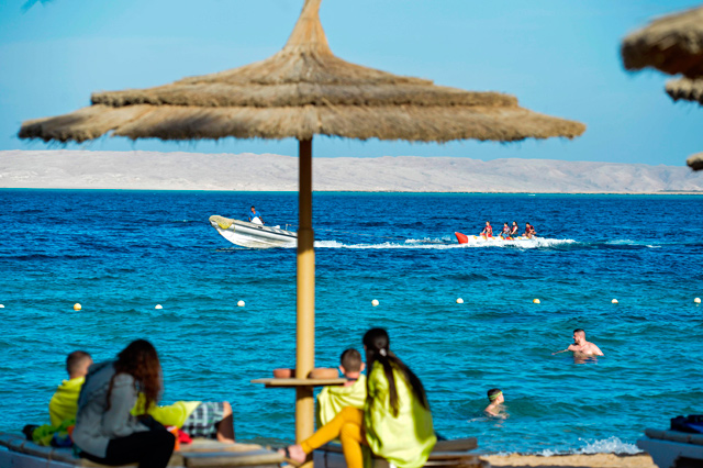 Tourists spend time at the beach in Egypt's Red Sea resort of Hurghada on February 18 (AFP photo)