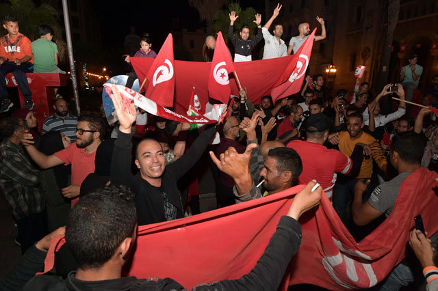 Tunisians gather to celebrate the victory of Kais Saied in the Tunisia's presidential runoff on Sunday in the capital Tunis (AFP photo)