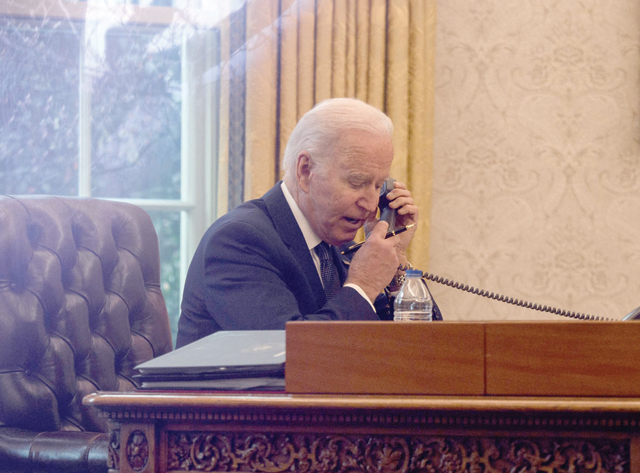 In this file photo taken on December 09, 2021, US President Joe Biden speaks on the phone with his Ukrainian counterpart Volodymyr Zelensky, in the Oval Office at the White House in Washington, DC (AFP photo)