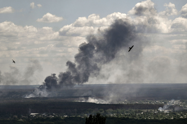 Smoke and dirt rise from shelling in the city of Severodonetsk during fight between Ukrainian and Russian troops in the eastern Ukrainian region of Donbas on Tuesday (AFP photo)
