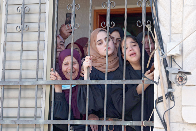 Relatives mourn during the funeral of Osama Soboh, a Palestinian man killed by Israeli forces during confrontations near Jenin, in the village of Burqin in the Israeli occupied West Bank, on Sunday (AFP photo)