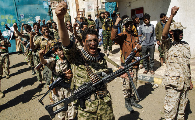 Newly recruited Houthi fighters chant slogans during a gathering in the capital Sanaa to mobilise more fighters to battlefronts to fight pro-government forces in several Yemeni cities on Thursday (AFP photo)
