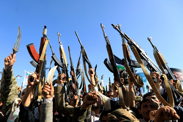 Yemenis brandishing rifles take part in a solidarity march with the Palestinian people of the Gaza Strip, in the Houthi-run capital Sanaa on Friday (AFP photo)