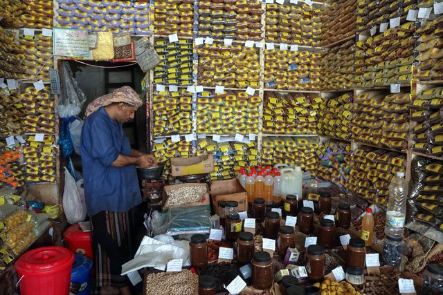 A Yemeni vendor works at his shop selling medicinal plants and spices at a market in Yemen's third city of Taez, on June 15 (AFP photo)