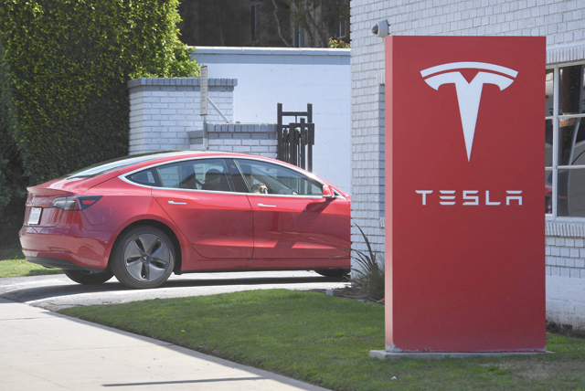 This file photo taken on March 4, 2019, shows a Tesla car as it arrives at a service centre after the company indicated it would be closing showrooms, and in the future, it would be selling its cars online, in Los Angeles, California (AFP photo)