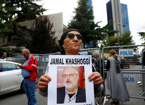 A human rights activist holds a photo of Saudi journalist Jamal Khashoggi during a protest outside the Saudi consulate in Istanbul, Turkey, on Tuesday (Reuters photo)