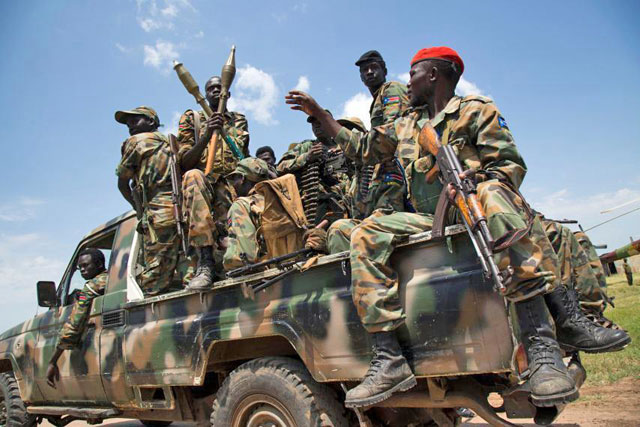 South Sudanese government soldiers sit in a pickup truck at the military base in Malakal, northern South Sudan, on October 16, 2016 (AFP photo)