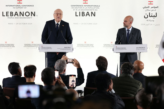Lebanon's Prime Minister Najib Mikati (left) speaks next to France's Foreign Affairs Minister Jean-Noel Barrot during a press conference after an international aid conference in support of Lebanon, in Paris on Thursday (AFP photo)