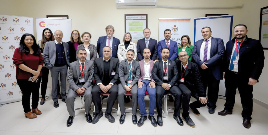 Guests pose for a photo during a ceremony to mark the renovation of the Life Support Programmes Training Centre with support from the Spanish government and the US Agency for International Development   