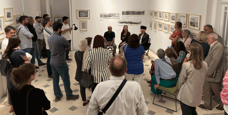 Guests during the opening of an exhibition by Myriam Ababsa, Saleem Quna and Adnan Younes Bazadugh titled ‘Amman’s Social History through Photography’ organised by Ifpo at the MMAG foundation  during the 11th Image Festival in Amman curated by Darat Al Tasweer  (Photo courtesy of Ifpo)