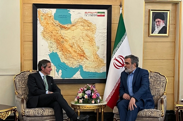 This handout photo released by Iran’s Atomic Energy Organisation shows its spokesman Behrouz Kamalvandi (right) meeting with Director General of the International Atomic Energy Agency (IAEA) Rafael Mariano Grossi upon his arrival in Tehran on Wednesday (AFP photo)