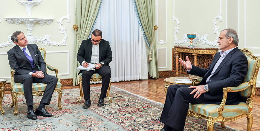 A handout photo provided by the Iranian presidency shows President Masoud Pezeshkian meeting with International Atomic Energy Agency chief Rafael Grossi (left) in Tehran on Thursday (AFP photo)