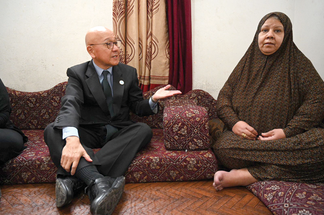 Japan’s Ambassador to Jordan Okuyama Jiro visits a shelter of Palestine refugees from Syria during his tour of Baqaa Palestine Refugee Camp on Tuesday (Photo courtesy of Japanese embassy)