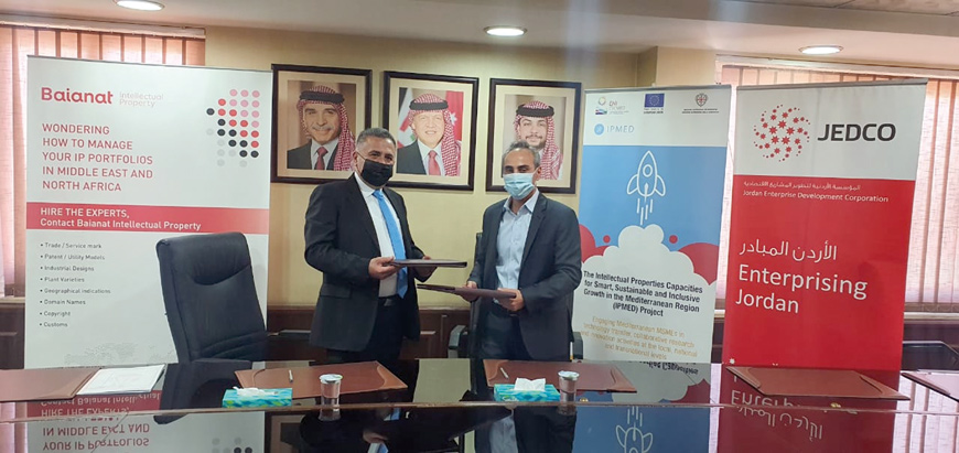 Adi Ghuneim, acting CEO of JEDCO, and representative of Baianat, Jehad Al Kharouf, pose for a photo during a signing ceremony on Wednesday (Photo courtesy of JEDCO)