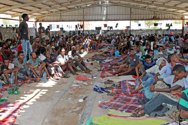 African migrants sit in a deportation centre in Aden, Yemen, on Saturday (Reuters photo)
