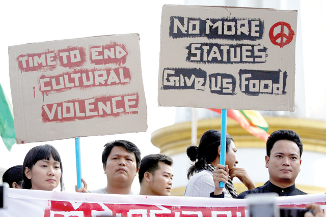 Youth protest against a statue of General Aung San, Myanmar's independence hero and the father of leader Aung San Suu Kyi located in Loikaw in Yangon, Myanmar, on Tuesday  (Reuters photo)