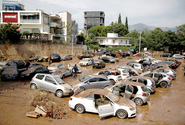 Damaged cars are seen following flash floods at Marousi suburb, near Athens, Greece, on Thursday (Reuters photo)