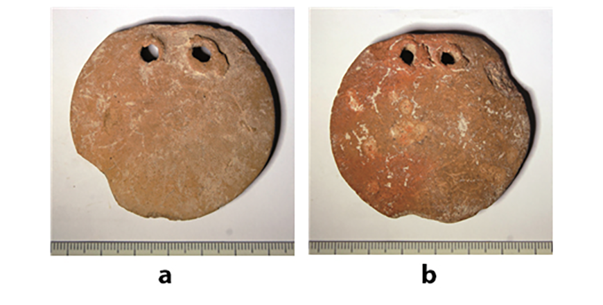 Loom weights from Phlamoudhi-Vounari with impressions of a textile (Photo courtesy of Cyprus Museum)