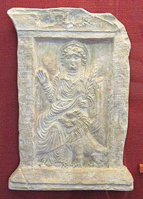 Goddess Allat with a palm tree and lion. Relief from the Ba'alshaminTemple (Photo courtesy of Owen Cook)