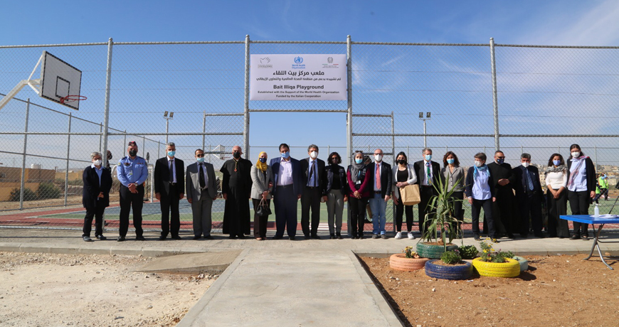 Guests pose for a group photo during the inauguration of the multi-purpose playground of Bait Illiqa Centre on Monday (Photo courtesy of WHO)