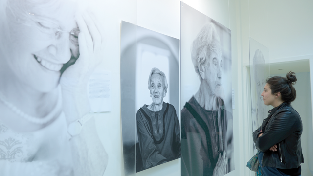 A visitor looks at the images and accompanying text composing photographer Nurith Wagner-Strauss’ exhibition at the Al Mashini Cultural Centre (Photo by Tanya Raghu)