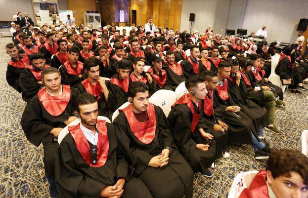 Youth sit for a graduation ceremony and to receive their 10th-grade equivalency certificates on Wednesday (Photo courtesy of USAID)