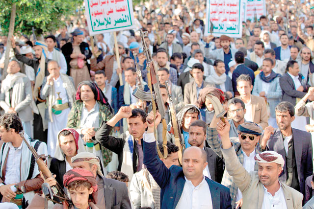 Supporters of Yemen's Shiite Houthi rebels chant slogans and raise Kalashnikov assault rifles as they gather for a rally in support of the group in the Houthi-held capital Sanaa on Friday (AFP photo)